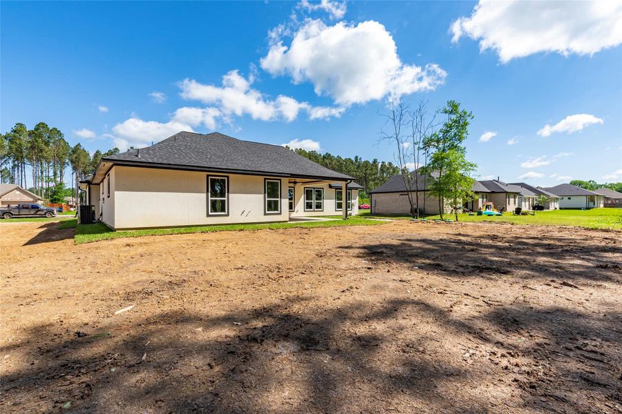 Front exterior of a new home in , Dayton, TX, highlighting curb appeal (Image 23).