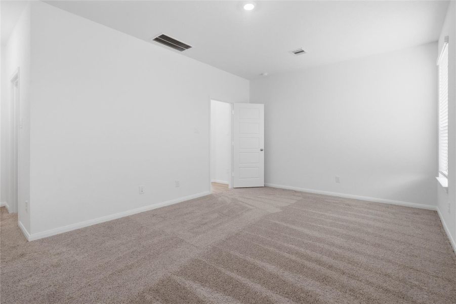 Additional view from primary bedroom--hallway to walk-in closet and primary bathroom.