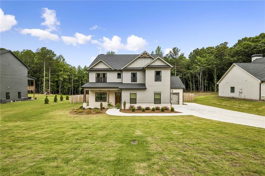 Front exterior of a new home in , Winder, GA, highlighting curb appeal (Image 1). Front exterior of a new home in , Winder, GA, highlighting curb appeal (Image 1).