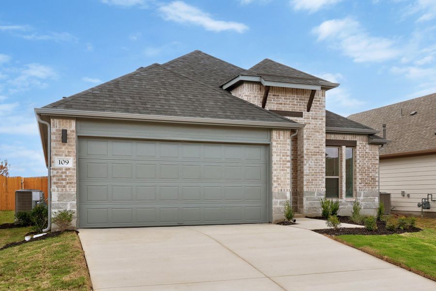Front exterior of a new home in Prairie Winds, Hutto, TX, highlighting curb appeal (Image 20). Front exterior of a new home in Prairie Winds, Hutto, TX, highlighting curb appeal (Image 20).