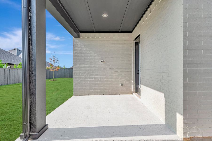 Exterior details and patio area of a home in Goodland – Classic Series, Grand Prairie (Image 3).