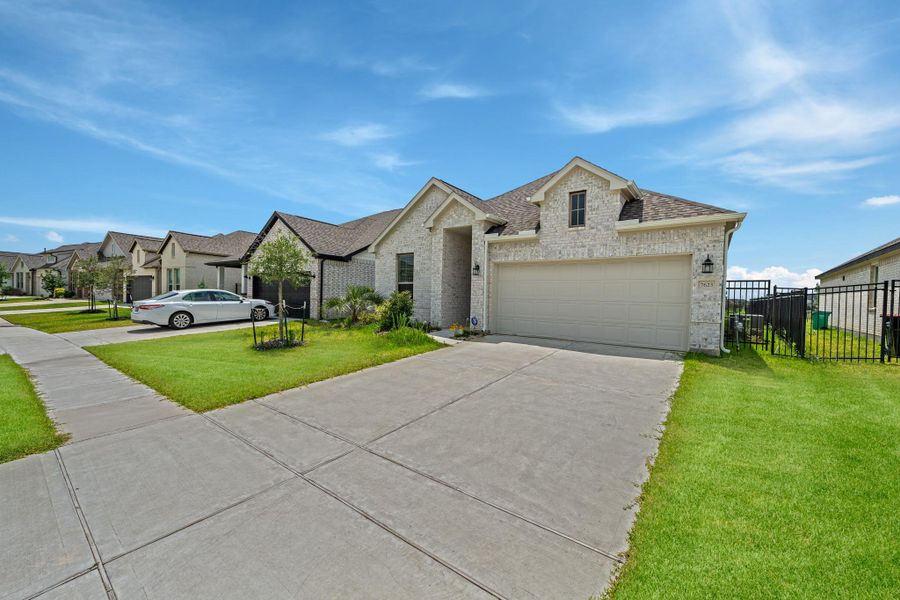 Front exterior of a new home in , Cypress, TX, highlighting curb appeal (Image 2). Front exterior of a new home in , Cypress, TX, highlighting curb appeal (Image 2).