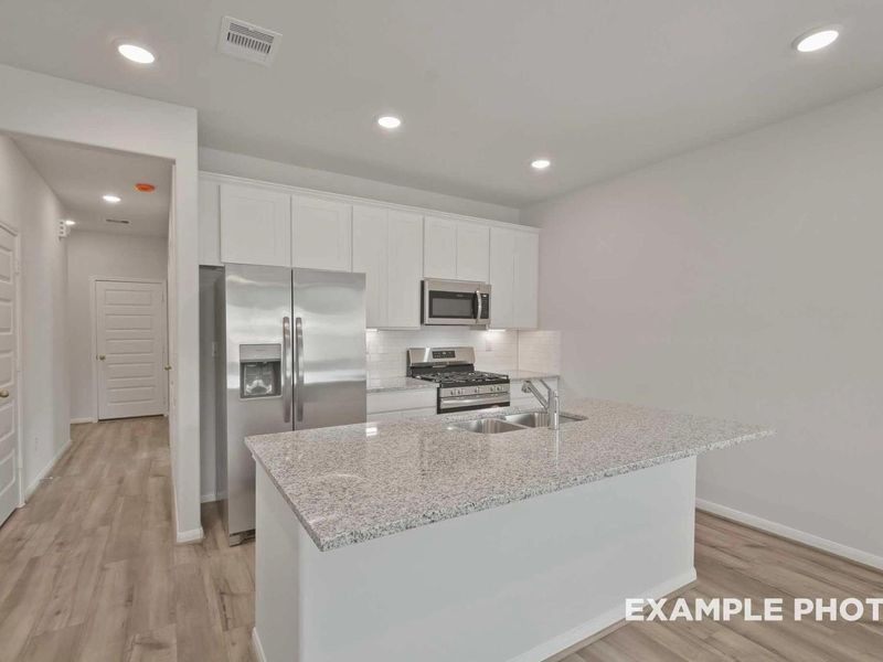 Furnished interior view inside a new home in Caney Creek Place, Conroe (Image 3).