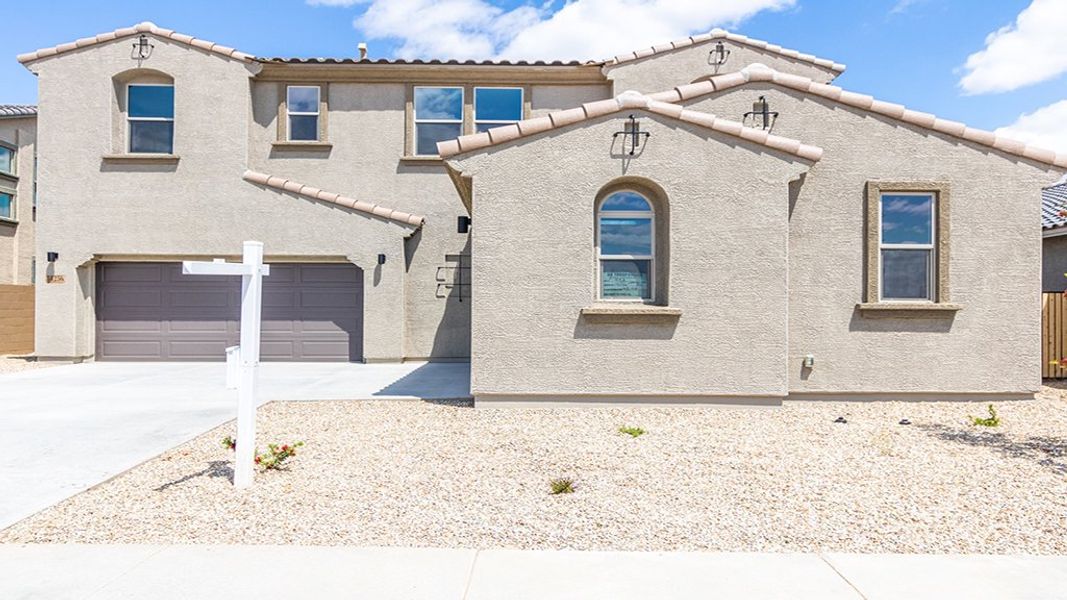 Representative exterior photo of a completed home built from the 45RM4 by Taylor Morrison in Almeria at Rancho Mercado, Surprise, AZ (Image 22).