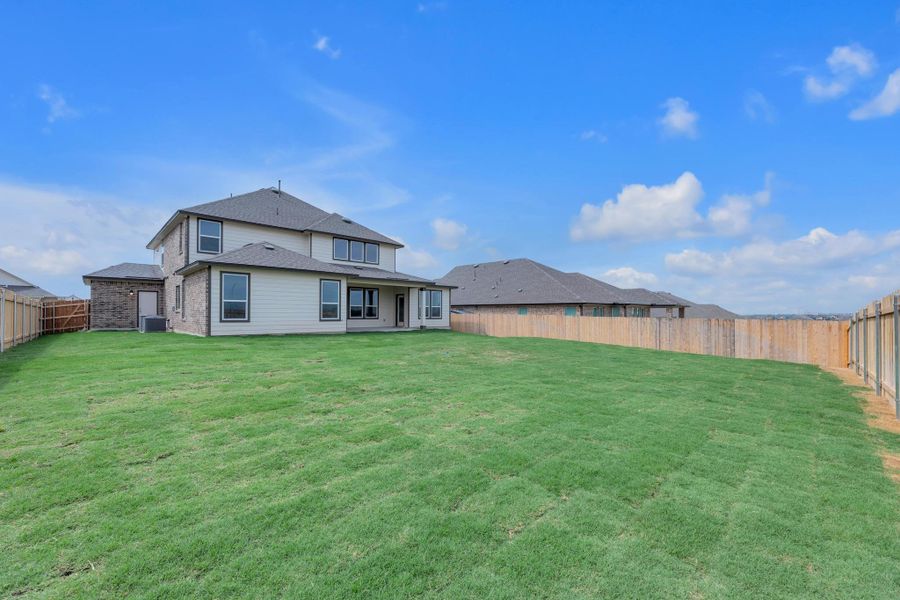 Front exterior of a new home in Salerno - Hallmark Collection, Round Rock, TX, highlighting curb appeal (Image 1). Front exterior of a new home in Salerno - Hallmark Collection, Round Rock, TX, highlighting curb appeal (Image 1).
