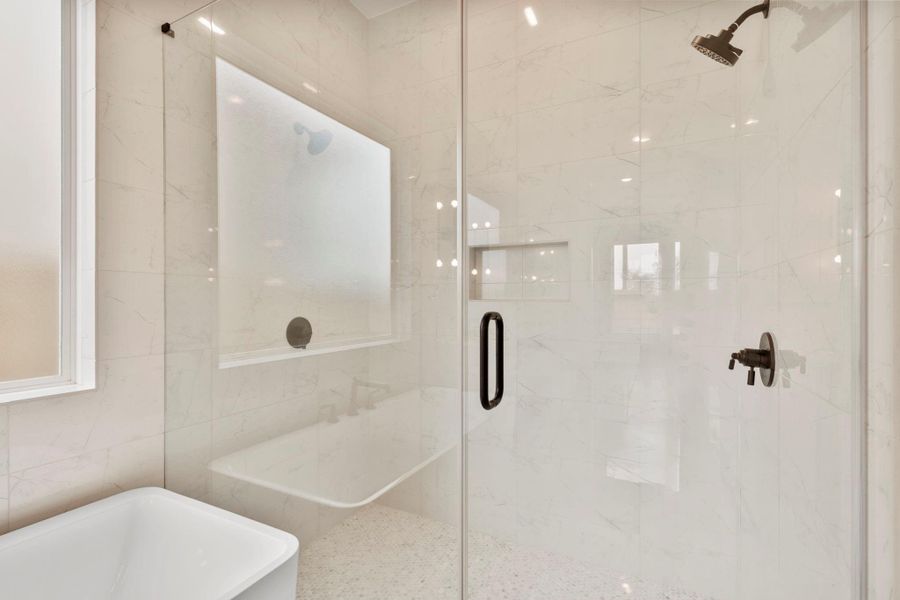 The enlarged shower includes 2 shower heads.