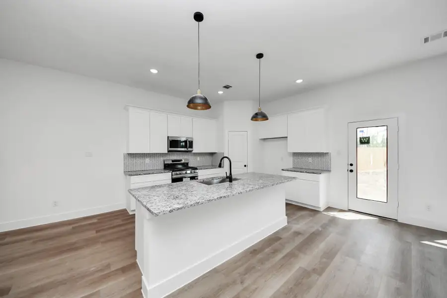 Furnished interior view inside a new home in , Huffman (Image 6).