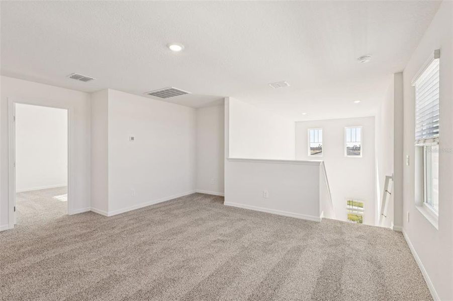 Spacious, unfurnished interior of a new home in The Reserve at Hammock Oaks - Classic Series, Lady Lake (Image 15).