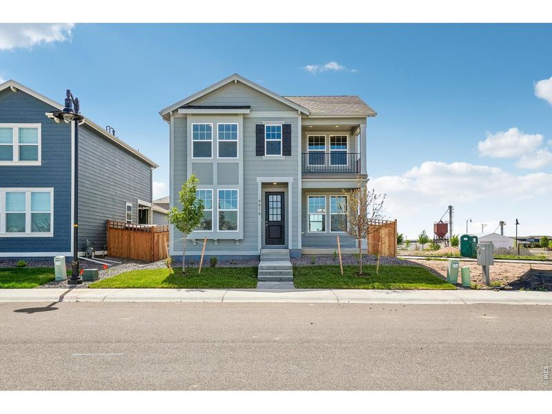 Front exterior of a new home in Timnath Lakes, Timnath, CO, highlighting curb appeal (Image 21). Front exterior of a new home in Timnath Lakes, Timnath, CO, highlighting curb appeal (Image 21).