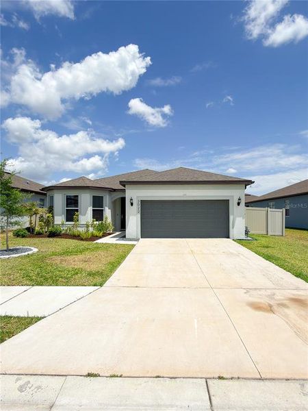 Front exterior of a new home in Marwood, Ellenton, FL, highlighting curb appeal (Image 1). Front exterior of a new home in Marwood, Ellenton, FL, highlighting curb appeal (Image 1).