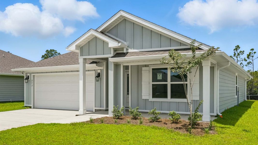 Front exterior of a new home in Palmetto Bluff, Port Saint Joe, FL, highlighting curb appeal (Image 20).
