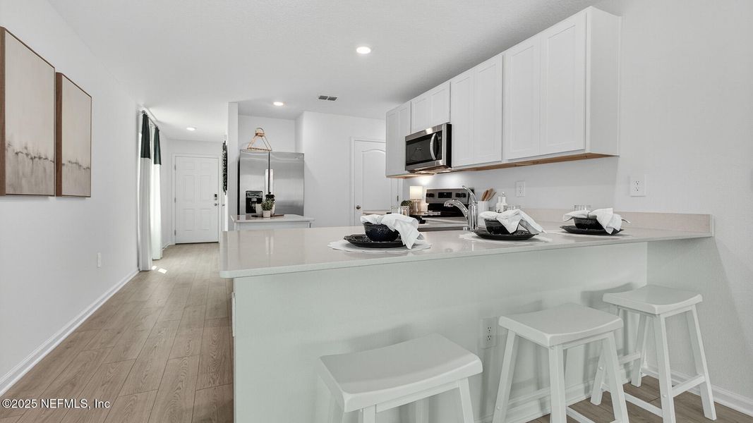Furnished interior in a model home at Trout River in Jacksonville (Image 9).