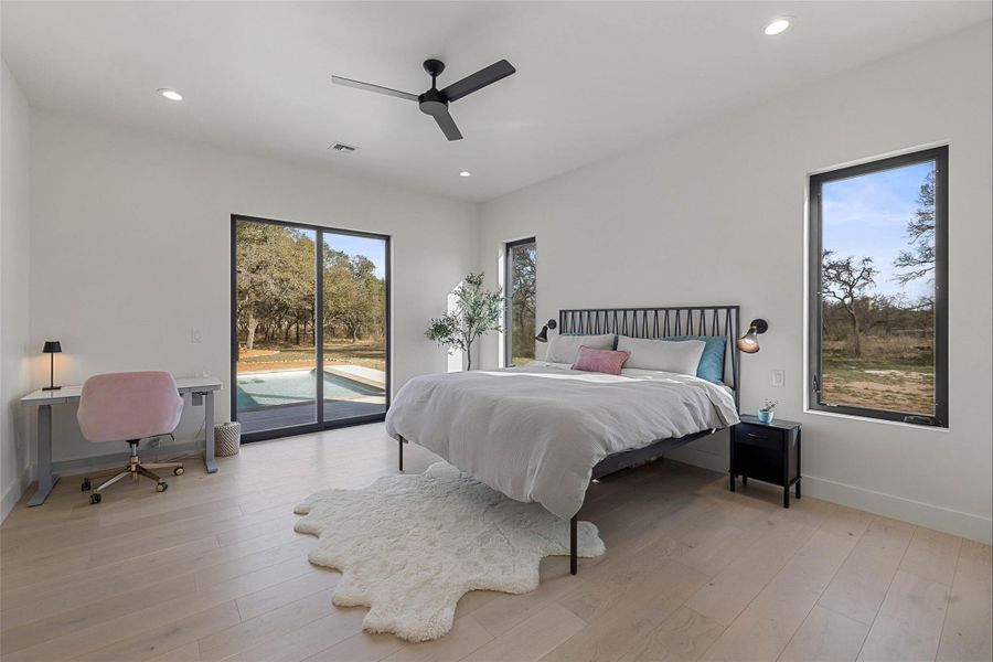 Bedroom featuring recessed lighting, access to exterior, light wood finished floors, a ceiling fan, and an office area