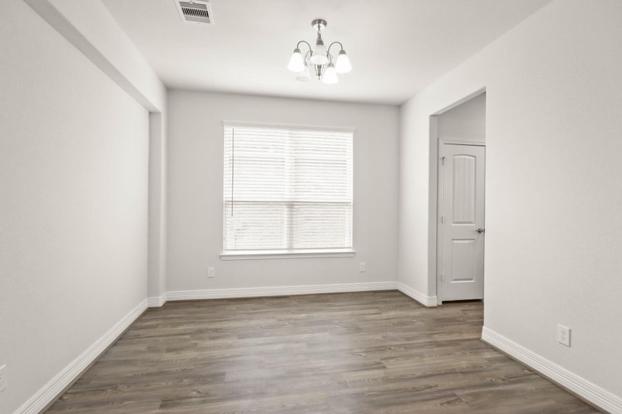This large formal dining room is right off the kitchen (to the right) and can easily fit that oversized dining table perfect for hosting. This could also be closed off and used as an additional room!