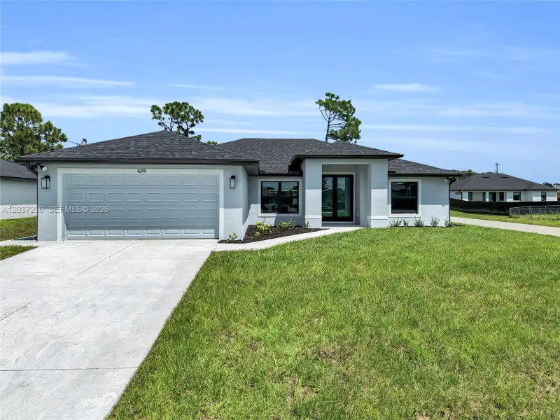 Front exterior of a new home in , Lehigh Acres, FL, highlighting curb appeal (Image 2). Front exterior of a new home in , Lehigh Acres, FL, highlighting curb appeal (Image 2).