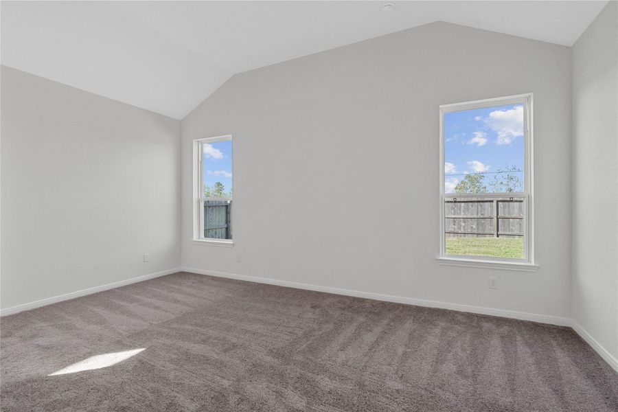 Unwind in your private sanctuary. This tranquil primary suite is a true retreat, offering a sense of calm and luxury. With a spacious layout, walk-in closet, and en-suite bath, it's the perfect place to start and end your day.