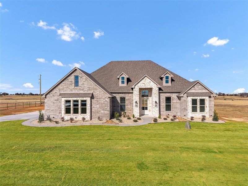 Front exterior of a new home in , Tolar, TX, highlighting curb appeal (Image 26).