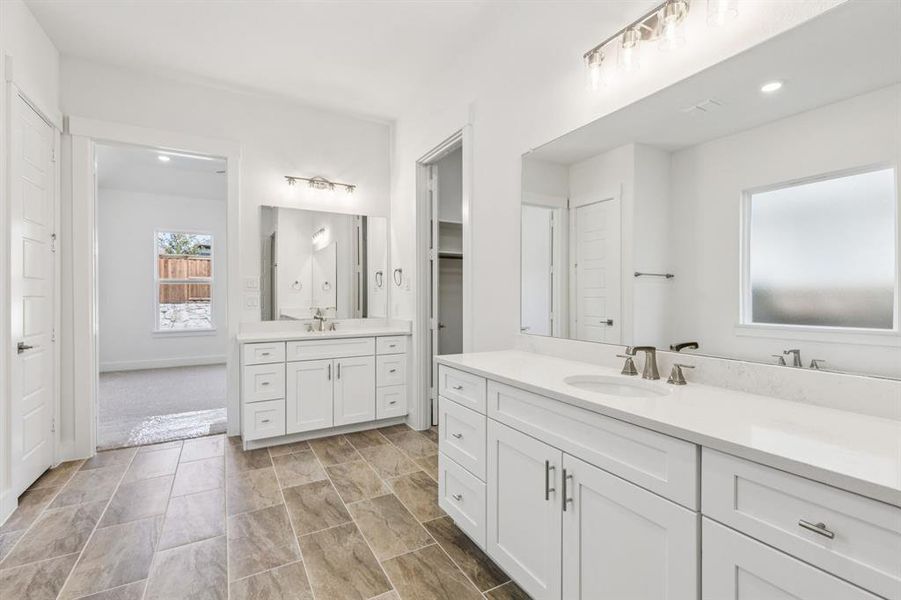 Featuring separate his and her vanities, you find ample room for two in this dream owner's bath!