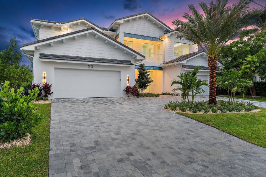 Front exterior of a new home in , Tequesta, FL, highlighting curb appeal (Image 28). Front exterior of a new home in , Tequesta, FL, highlighting curb appeal (Image 28).