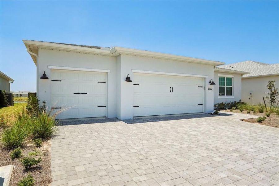 Exterior details and patio area of a home in Crescent Lakes - Signature Series, Punta Gorda (Image 14).