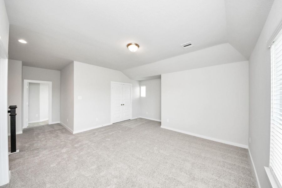 Come upstairs and enjoy a day of leisure in this fabulous game room! This is the perfect hangout spot or adult game room! Features plush carpet, high ceilings, custom paint and windows for plenty of natural light. Come upstairs and enjoy a day of leisure in this fabulous game room! This is the perfect hangout spot or adult game room! Features plush carpet, high ceilings, custom paint and windows for plenty of natural light.