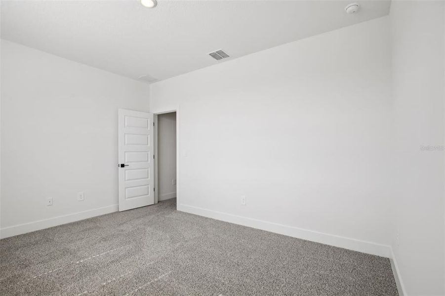 Spacious, unfurnished interior of a new home in Magnolia Bay - Reserve Series, Nokomis (Image 32).