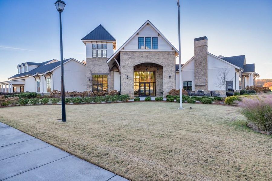 Front exterior of a new home in Del Webb Chateau Elan, Hoschton, GA, highlighting curb appeal (Image 1).