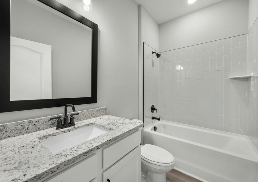 Secondary bathroom with a shower/tub combination