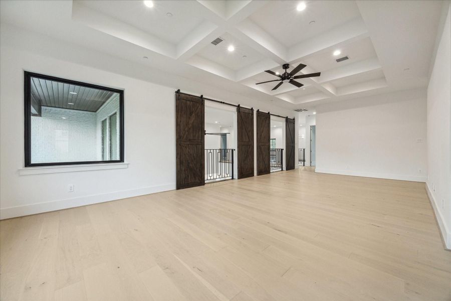 Game Room with barn style doors and custom millwork on ceiling Game Room with barn style doors and custom millwork on ceiling