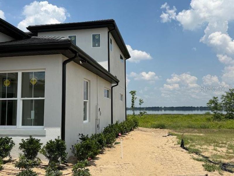 Front exterior of a new home in , Lake Alfred, FL, highlighting curb appeal (Image 2).