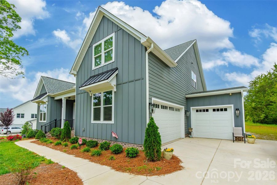 Front exterior of a new home in , Clover, SC, highlighting curb appeal (Image 21).