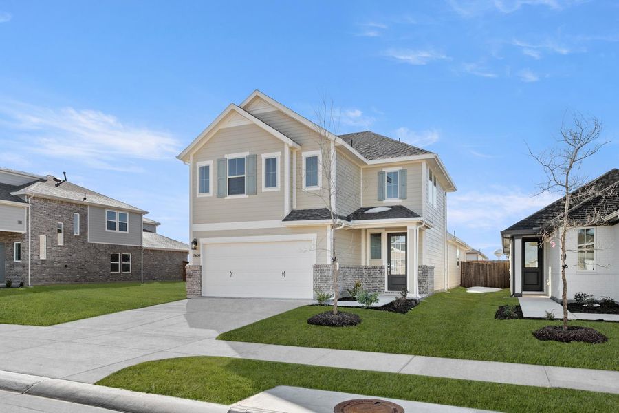 Front exterior of a new home in The Meadows, Denton, TX, highlighting curb appeal (Image 2). Front exterior of a new home in The Meadows, Denton, TX, highlighting curb appeal (Image 2).