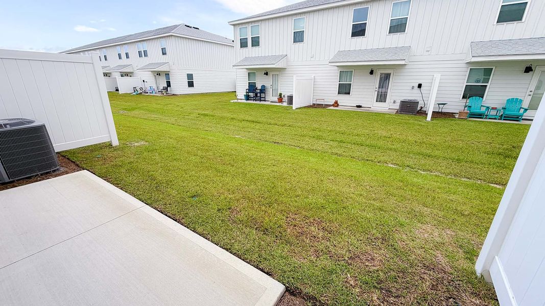 Exterior details and patio area of a home in Salt Creek Townhomes at Mexico Beach, Mexico Beach (Image 22).