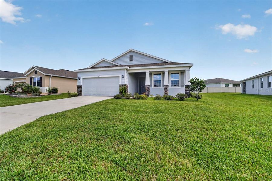 Front exterior of a new home in , Ocala, FL, highlighting curb appeal (Image 22). Front exterior of a new home in , Ocala, FL, highlighting curb appeal (Image 22).