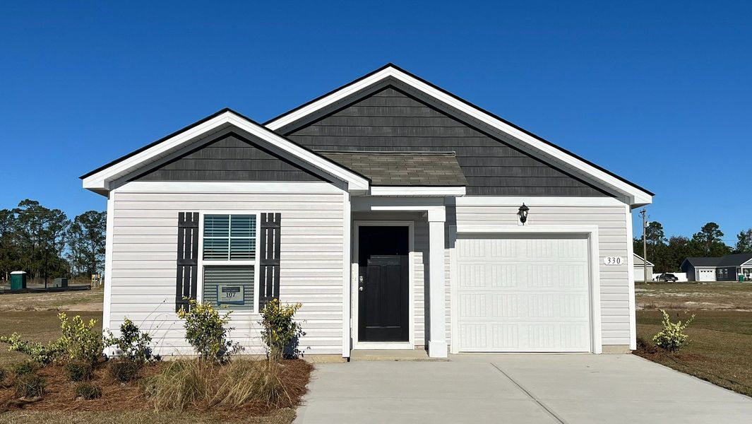 Representative exterior photo of a completed home built from the DEVON by D.R. Horton in Lochaven, Conway, SC (Image 2).