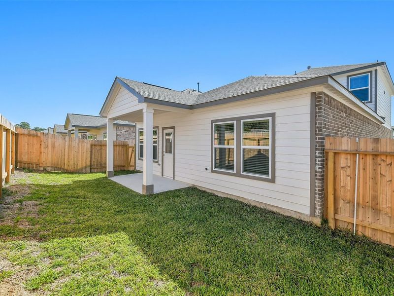 Exterior details and patio area of a home in Lakes at Black Oak, Magnolia (Image 19).