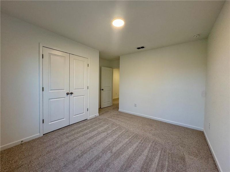 Spacious, unfurnished interior of a new home in Eastlyn Crossing, Flowery Branch (Image 22).