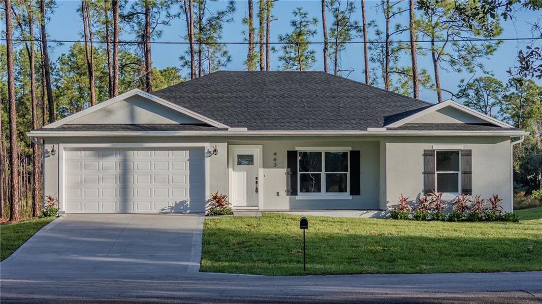 Front exterior of a new home in , Deltona, FL, highlighting curb appeal (Image 13).