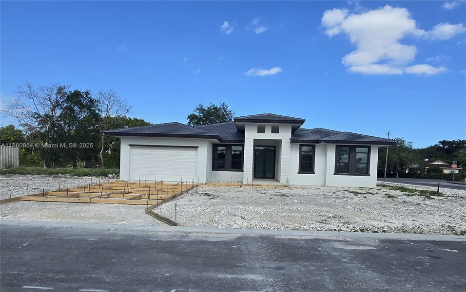 Front exterior of a new home in , Miami, FL, highlighting curb appeal (Image 18).