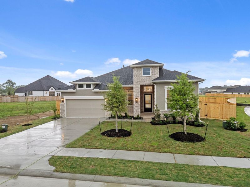 Front exterior of a new home in Briarley, Montgomery, TX, highlighting curb appeal (Image 7).