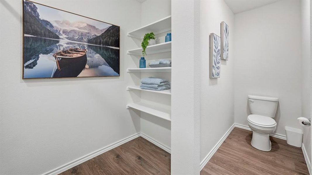 Bathroom with dark wood finished floors and baseboards Bathroom with dark wood finished floors and baseboards
