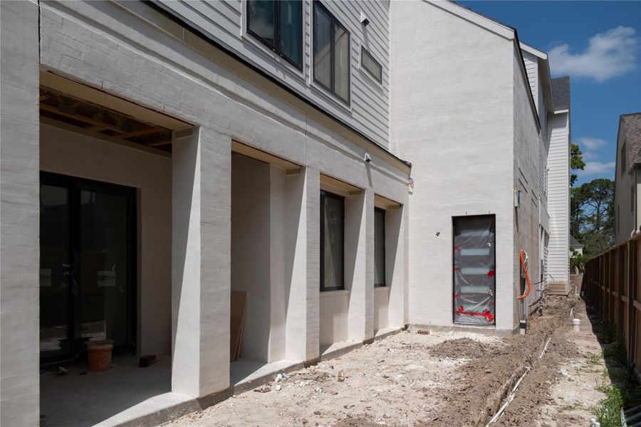 Backyard space and covered patio on Unit B/C.