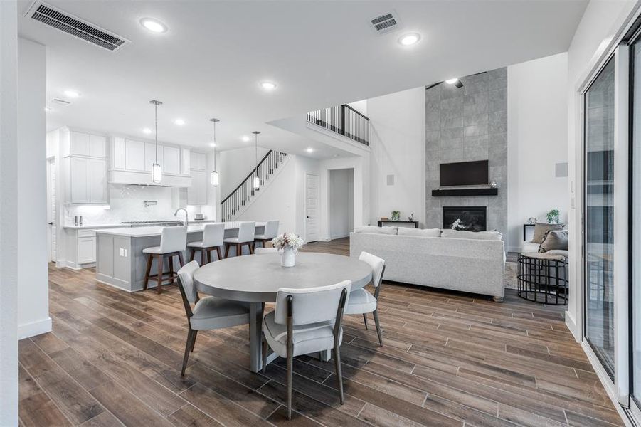 The informal dining area separates the Great Room from Game Room.  This area features glass sliding doors that open completely to the patio seamlessly blending the indoor and outdoor spaces.