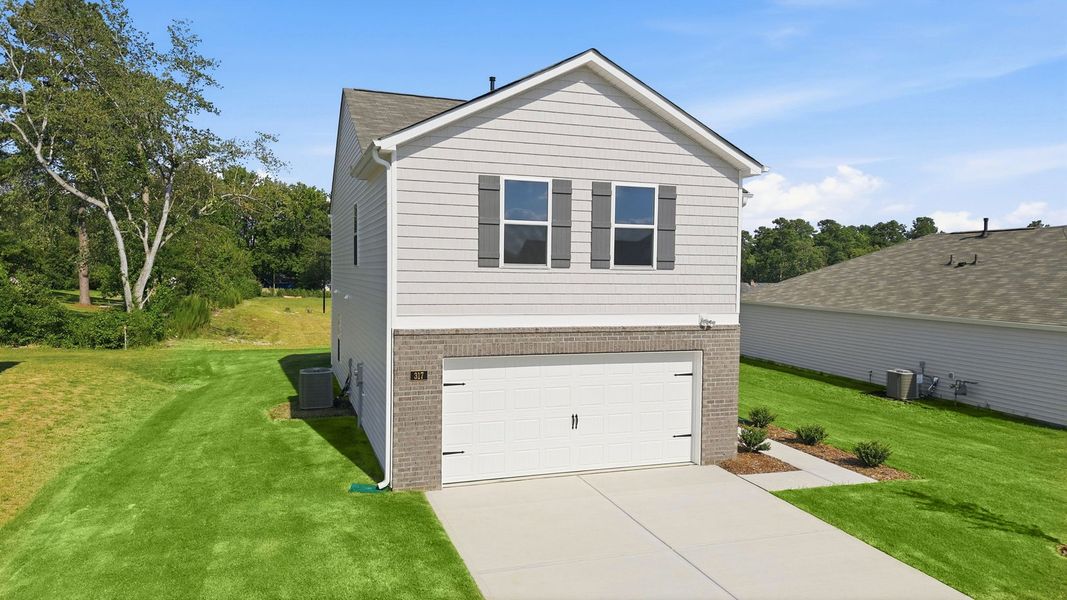 Front exterior of a new home in Hunter Hill, Rocky Mount, NC, highlighting curb appeal (Image 16).