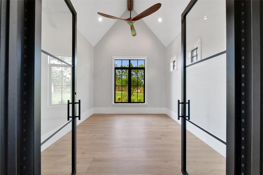 A large study is tucked away, close enough to feel involved, but private enough to handle your business professionally.