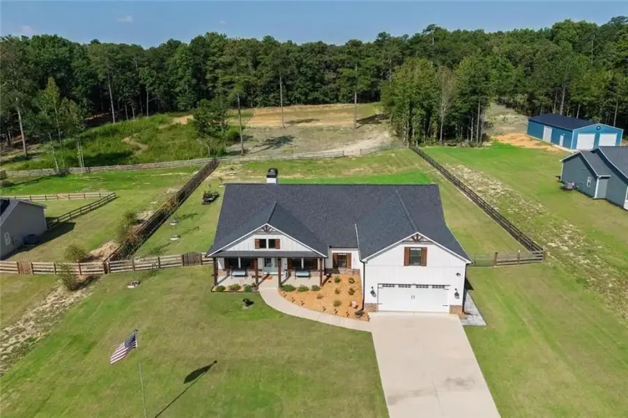 Front exterior of a new home in , Dallas, GA, highlighting curb appeal (Image 24).