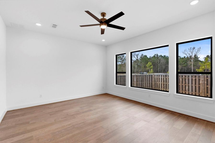 Very spacious, primary suite bedroom.