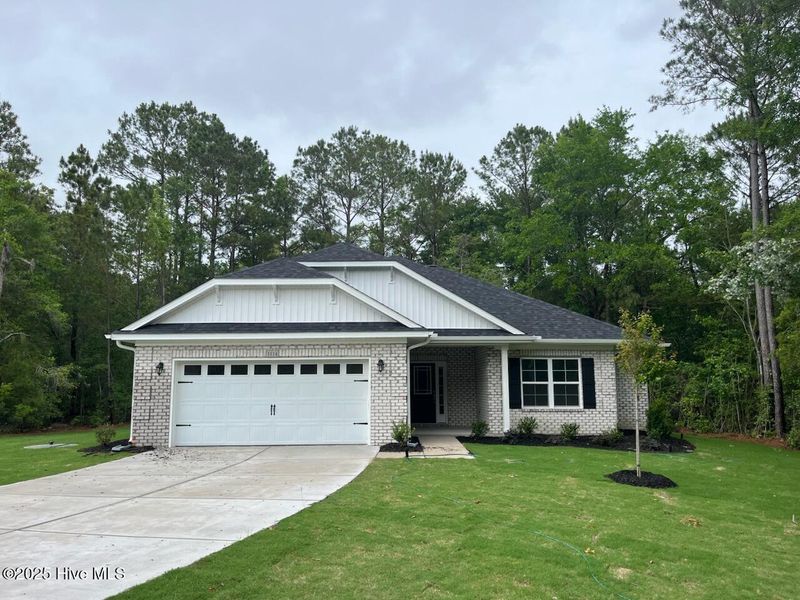 Front exterior of a new home in Palmetto Creek, Bolivia, NC, highlighting curb appeal (Image 1). Front exterior of a new home in Palmetto Creek, Bolivia, NC, highlighting curb appeal (Image 1).