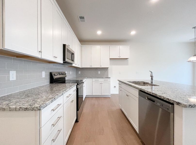 Furnished interior view inside a new home in Bellevue Townhomes, Greenville (Image 8).