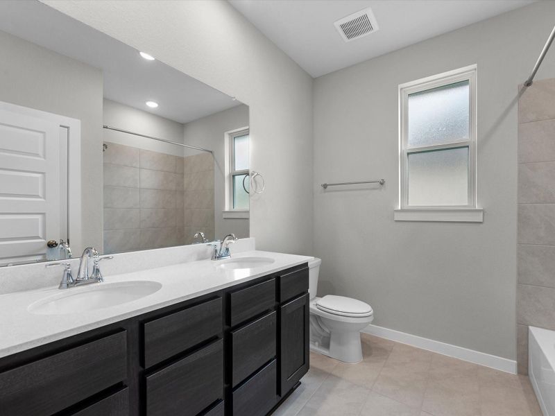 Furnished interior view inside a new home in Mason Woods, Cypress (Image 9).